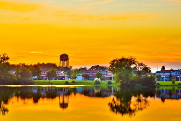 Sunset Picture Of Community From The Lake
